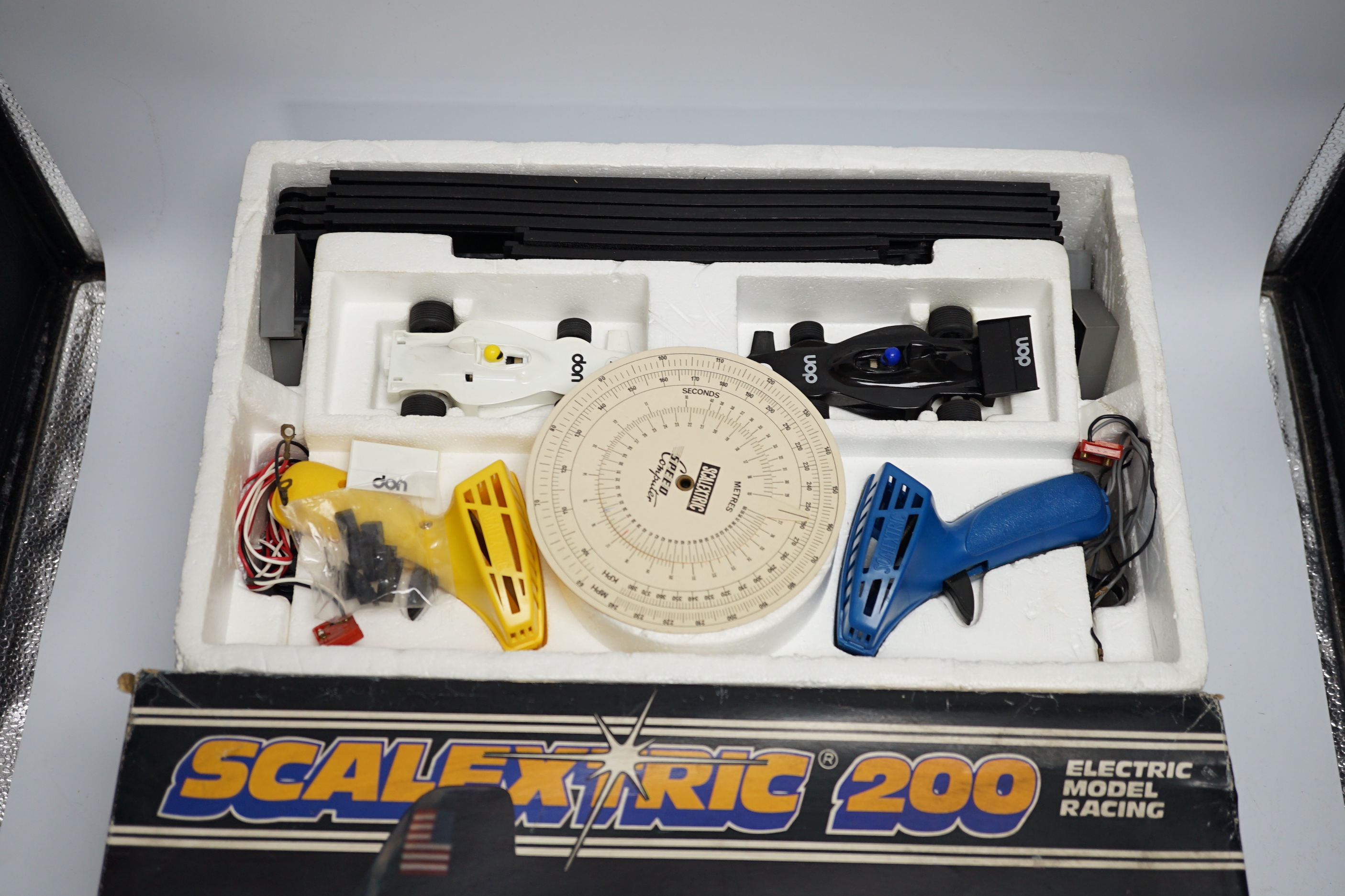 A Scalextric 200 set, comprising of two cars, controllers, track sections, etc.